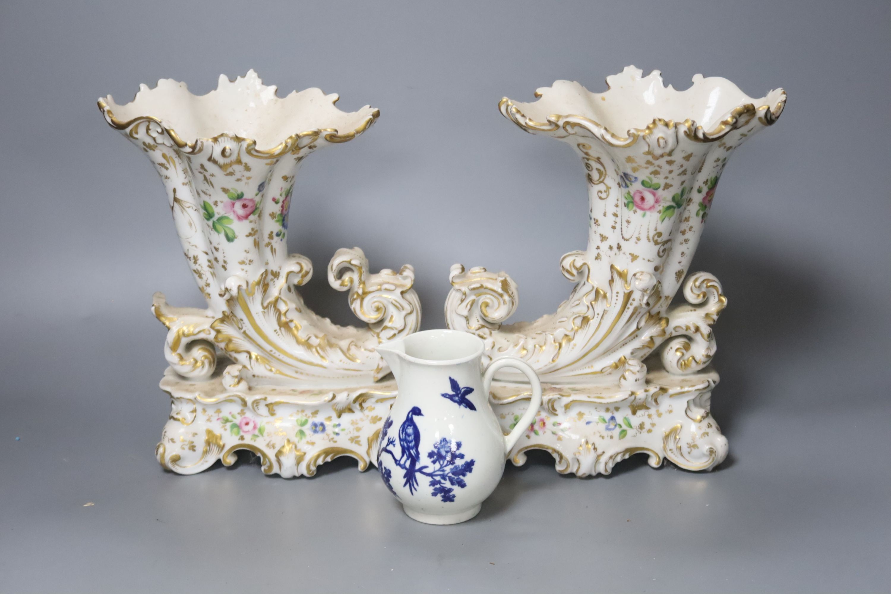 A pair of mid 19th century Jacob Petit cornucopia vases and a Worcester blue and white jug, tallest 20cm